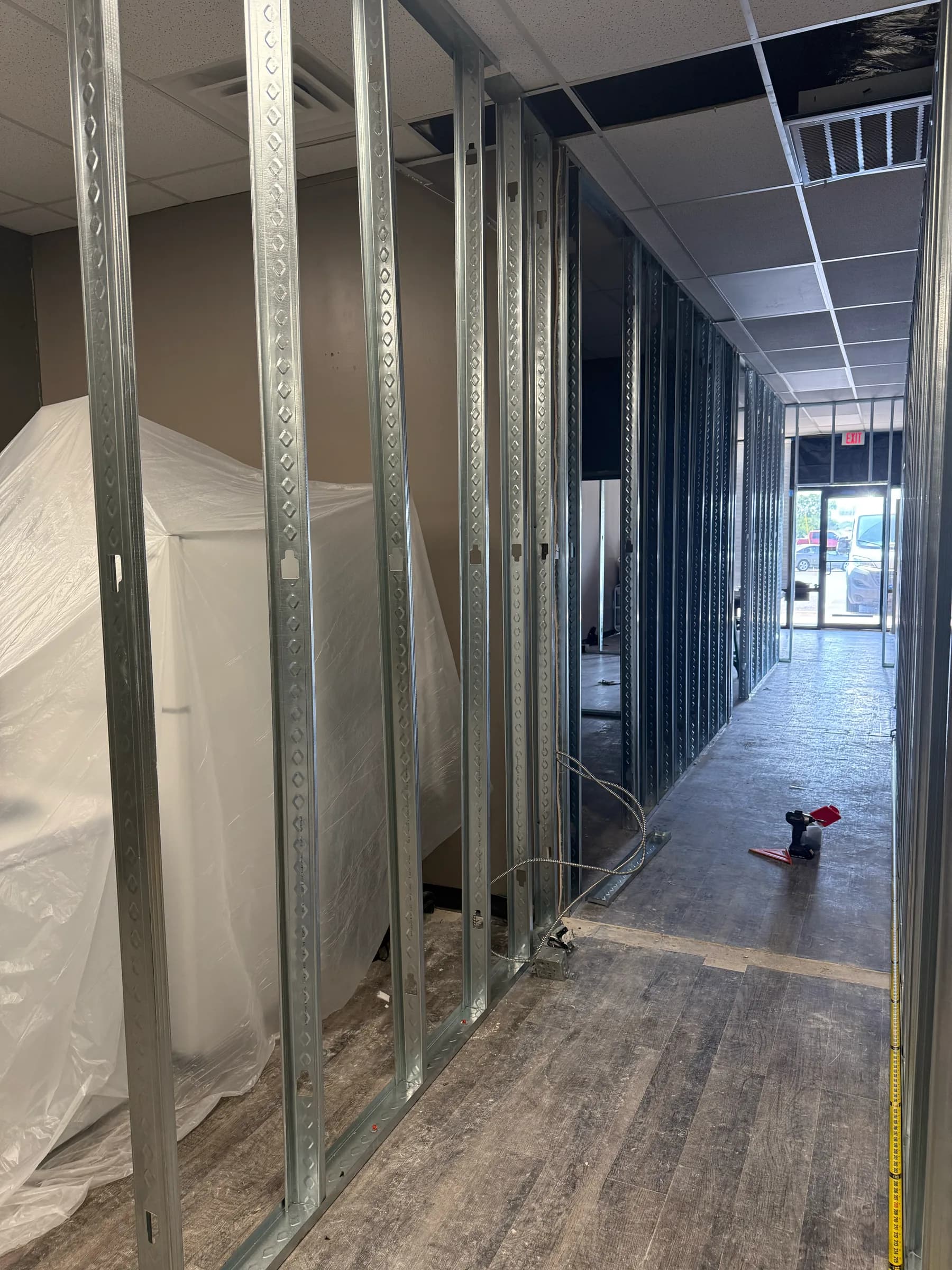 Commercial metal stud wall framing and ceiling channels in progress