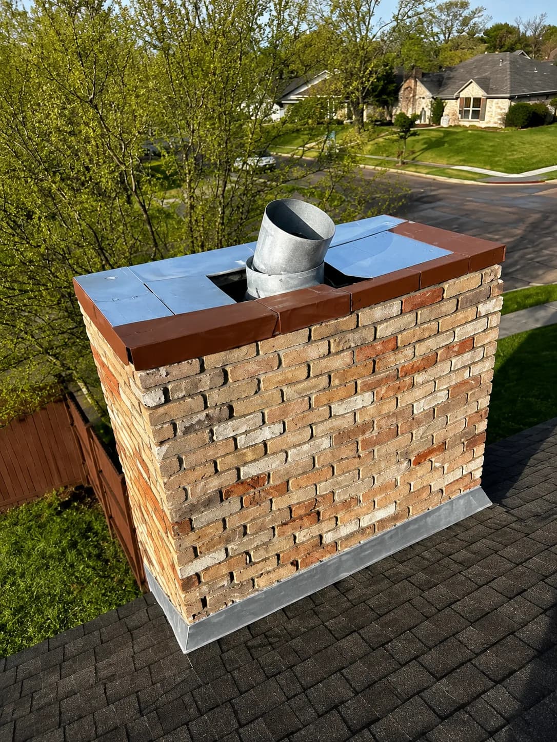 Completed exterior masonry and roofing work